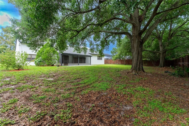 6019 Crystal View Dr, Orlando, FL 32819 - fenced backyard with a sunroom