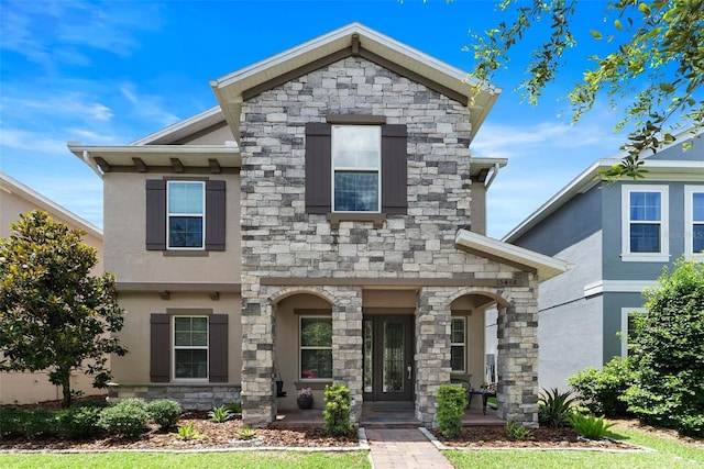 15448 Murcott Blossom Blvd, Winter Garden, FL 34787 - view of front of home with stone siding and stucco siding