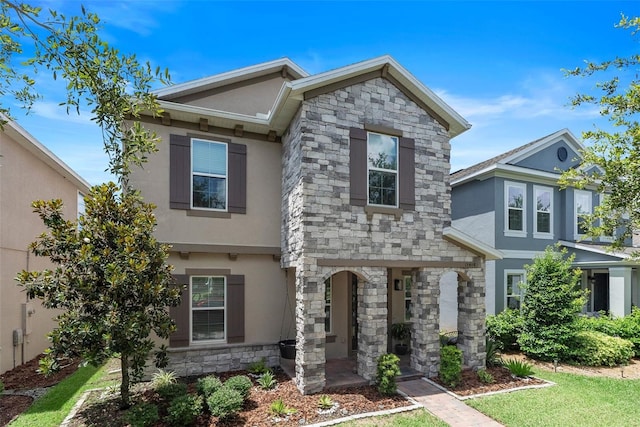 15448 Murcott Blossom Blvd, Winter Garden, FL 34787 - view of front of home with stucco siding and stone siding