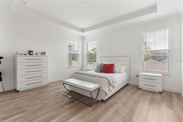 15448 Murcott Blossom Blvd, Winter Garden, FL 34787 - bedroom featuring a tray ceiling and light wood-style floors