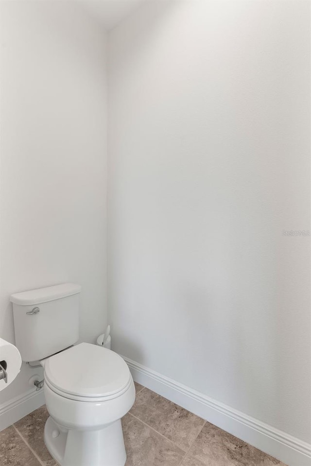 15448 Murcott Blossom Blvd, Winter Garden, FL 34787 - bathroom featuring toilet and tile patterned flooring