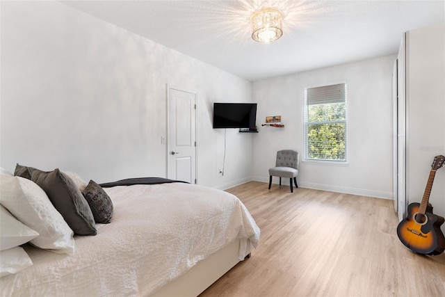 15448 Murcott Blossom Blvd, Winter Garden, FL 34787 - bedroom with light wood-style floors and baseboards