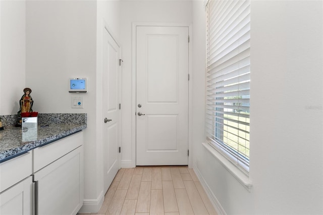 15448 Murcott Blossom Blvd, Winter Garden, FL 34787 - doorway to outside with baseboards and light wood finished floors