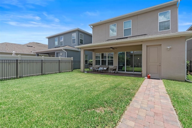 15448 Murcott Blossom Blvd, Winter Garden, FL 34787 - back of property with stucco siding, a ceiling fan, and a patio