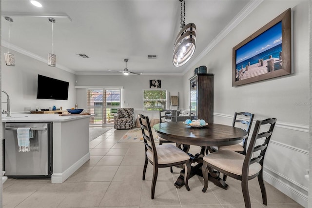 1191 Honey Blossom Dr Unit D, Orlando, FL 32824 - dining space featuring crown molding, light tile patterned floors, and ceiling fan