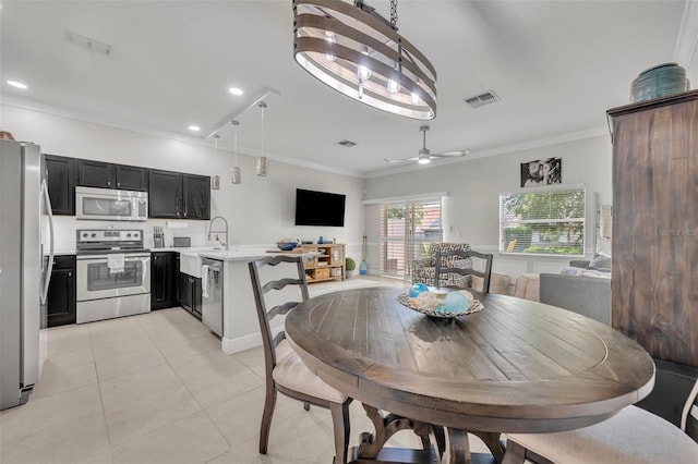 1191 Honey Blossom Dr Unit D, Orlando, FL 32824 - dining room with crown molding, light tile patterned flooring, ceiling fan, and recessed lighting