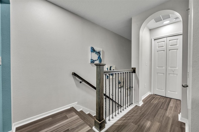1191 Honey Blossom Dr Unit D, Orlando, FL 32824 - stairway featuring wood finished floors and arched walkways