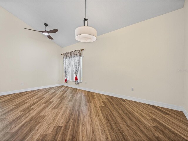 1111 Liberty Hall Dr, Kissimmee, FL 34746 - unfurnished room featuring wood finished floors, a ceiling fan, and high vaulted ceiling