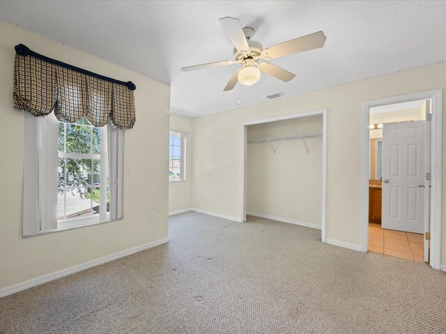 1111 Liberty Hall Dr, Kissimmee, FL 34746 - unfurnished bedroom with carpet floors, a closet, and ceiling fan