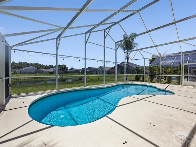 1111 Liberty Hall Dr, Kissimmee, FL 34746 - outdoor pool featuring a patio area, a lanai, a residential view, and a water view
