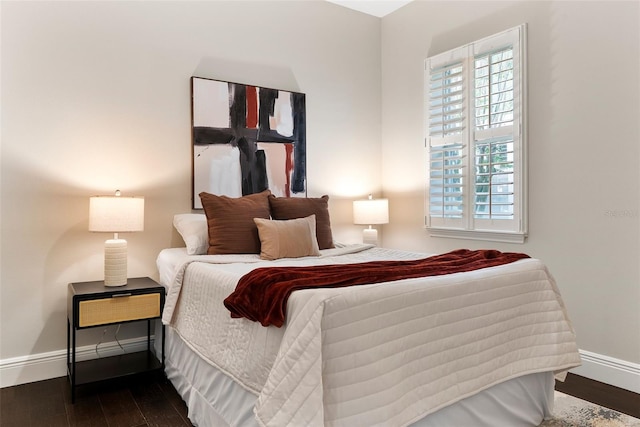 4310 Ethan Ln, Orlando, FL 32814 - bedroom with baseboards and dark wood-style flooring