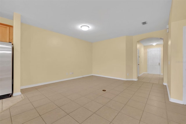 1534 Barking Deer Cv, Casselberry, FL 32707 - empty room with arched walkways and light tile patterned floors