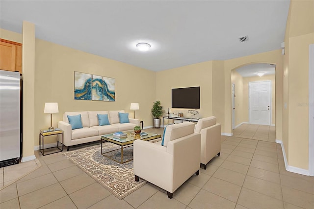 1534 Barking Deer Cv, Casselberry, FL 32707 - living room featuring arched walkways and light tile patterned floors