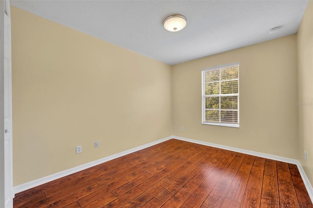 1534 Barking Deer Cv, Casselberry, FL 32707 - empty room with dark wood-type flooring and a smoke detector