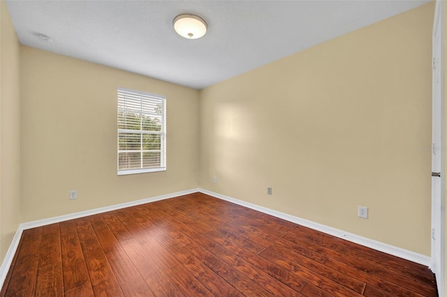 1534 Barking Deer Cv, Casselberry, FL 32707 - empty room featuring dark wood-style floors and a smoke detector
