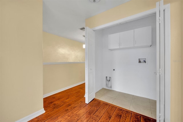 1534 Barking Deer Cv, Casselberry, FL 32707 - laundry area with washer hookup, wood finished floors, and gas dryer hookup