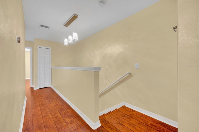 1534 Barking Deer Cv, Casselberry, FL 32707 - corridor featuring an upstairs landing and wood-type flooring