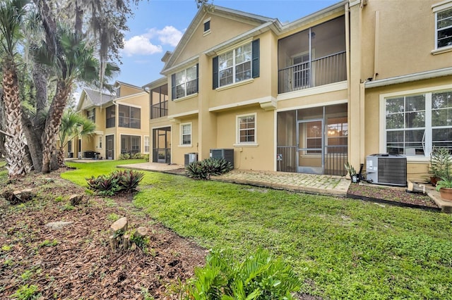 1534 Barking Deer Cv, Casselberry, FL 32707 - rear view of house with stucco siding and a lawn