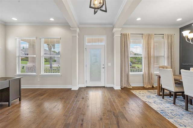 16412 Good Hearth Blvd, Clermont, FL 34711 - foyer with a chandelier, hardwood / wood-style floors, decorative columns, and ornamental molding
