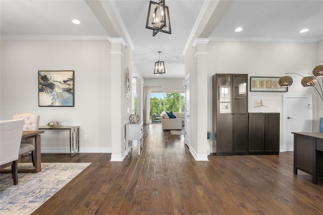 16412 Good Hearth Blvd, Clermont, FL 34711 - foyer entrance featuring dark wood finished floors, ornate columns, ornamental molding, a chandelier, and recessed lighting