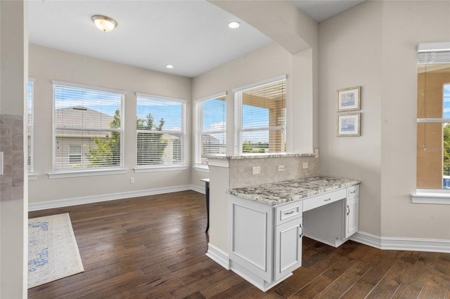 16412 Good Hearth Blvd, Clermont, FL 34711 - kitchen featuring dark wood-style flooring, white cabinets, recessed lighting, backsplash, and light stone countertops