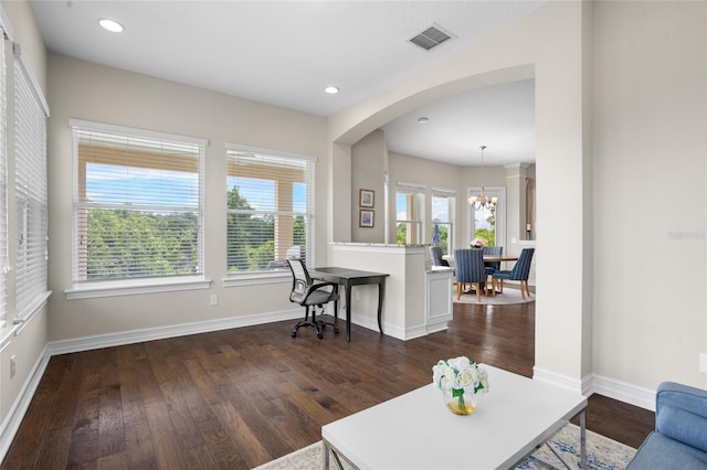 16412 Good Hearth Blvd, Clermont, FL 34711 - living room featuring dark wood-style floors, a chandelier, arched walkways, and recessed lighting