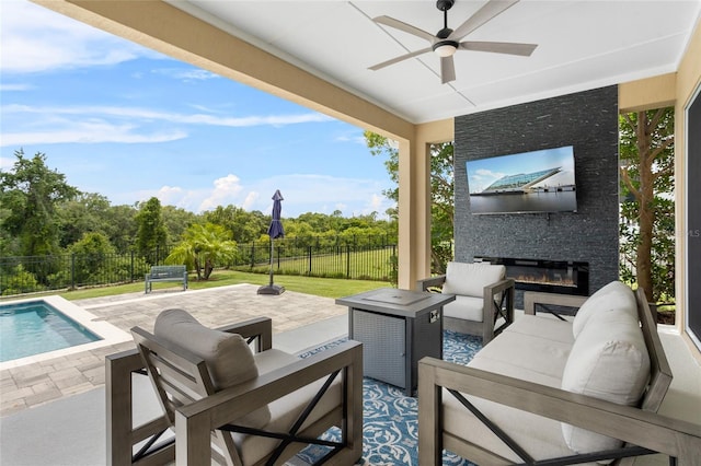 16412 Good Hearth Blvd, Clermont, FL 34711 - fenced backyard with a patio area, an outdoor living space with a fireplace, and a ceiling fan