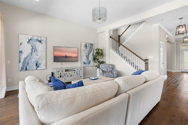 16412 Good Hearth Blvd, Clermont, FL 34711 - living area featuring ornate columns, hardwood / wood-style floors, a chandelier, and stairway