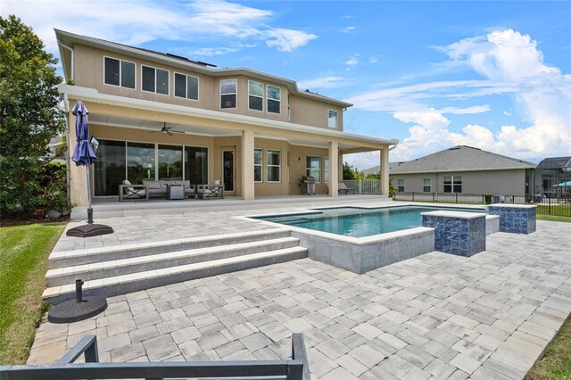 16412 Good Hearth Blvd, Clermont, FL 34711 - rear view of property with a patio, ceiling fan, a jacuzzi, a fenced backyard, and an outdoor hangout area