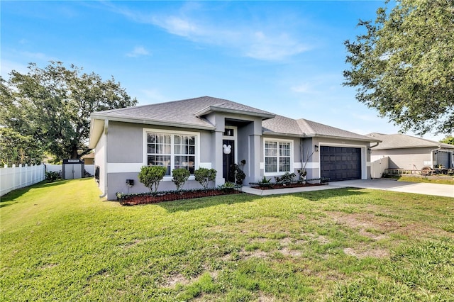 2919 Foraker Way, Kissimmee, FL 34758 - view of front of home with stucco siding, concrete driveway, a garage, and a shingled roof