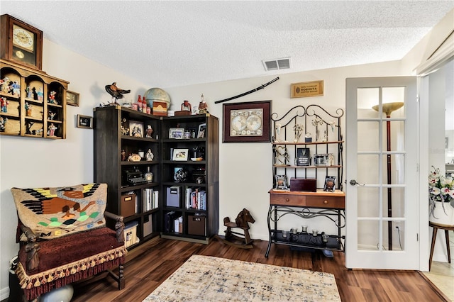 2919 Foraker Way, Kissimmee, FL 34758 - living area with wood finished floors and a textured ceiling