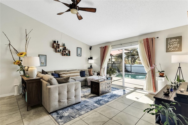 2919 Foraker Way, Kissimmee, FL 34758 - living area with a ceiling fan, light tile patterned floors, a textured ceiling, and lofted ceiling