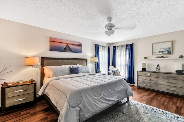 2919 Foraker Way, Kissimmee, FL 34758 - bedroom with dark wood finished floors, a textured ceiling, and a ceiling fan