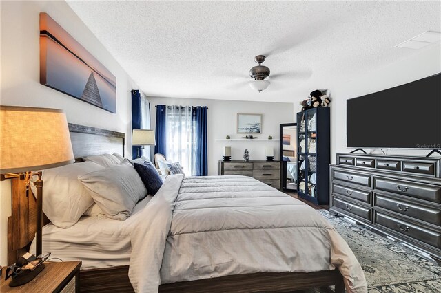 2919 Foraker Way, Kissimmee, FL 34758 - bedroom featuring a textured ceiling and a ceiling fan