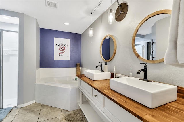 2919 Foraker Way, Kissimmee, FL 34758 - full bathroom with tile patterned floors, a garden tub, double vanity, recessed lighting, and a shower