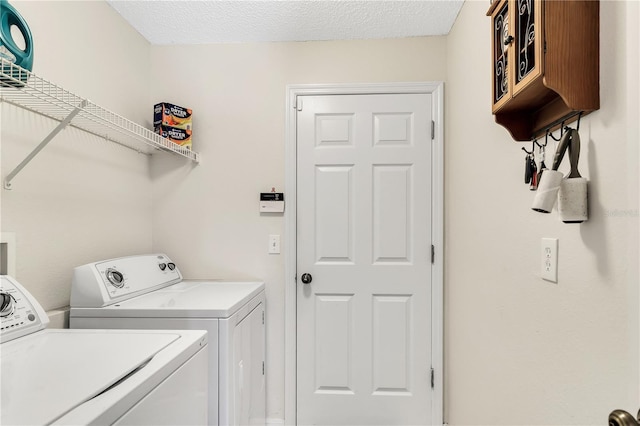 2919 Foraker Way, Kissimmee, FL 34758 - washroom with washer and dryer and a textured ceiling