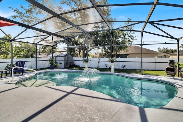 2919 Foraker Way, Kissimmee, FL 34758 - view of pool featuring a patio area, a shed, a fenced backyard, and glass enclosure