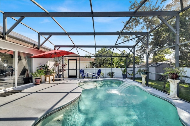 2919 Foraker Way, Kissimmee, FL 34758 - view of swimming pool with a storage unit, a patio area, and glass enclosure