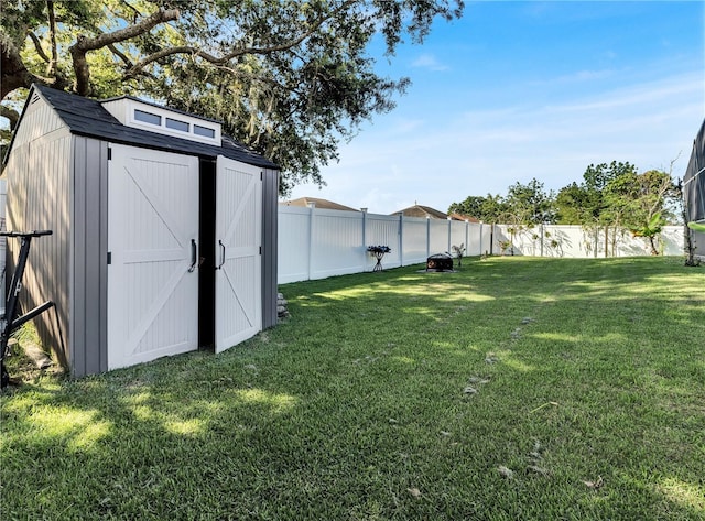 2919 Foraker Way, Kissimmee, FL 34758 - fenced backyard featuring a storage unit