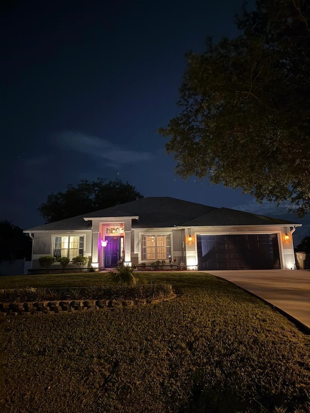 2919 Foraker Way, Kissimmee, FL 34758 - single story home featuring concrete driveway, a garage, and a lawn