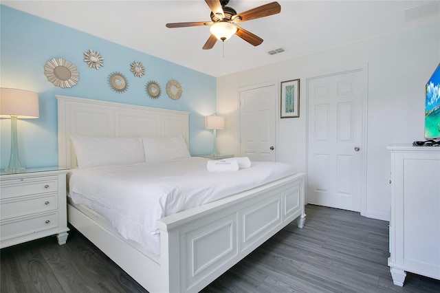 2669 Manesty Ln, Kissimmee, FL 34747 - bedroom with dark wood-style floors and ceiling fan
