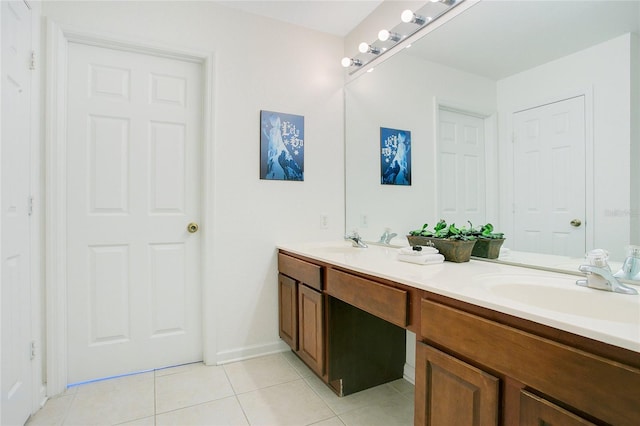 2669 Manesty Ln, Kissimmee, FL 34747 - bathroom featuring double vanity and tile patterned floors