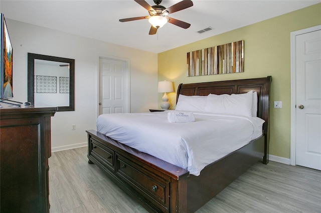 2669 Manesty Ln, Kissimmee, FL 34747 - bedroom with light wood-style floors and ceiling fan