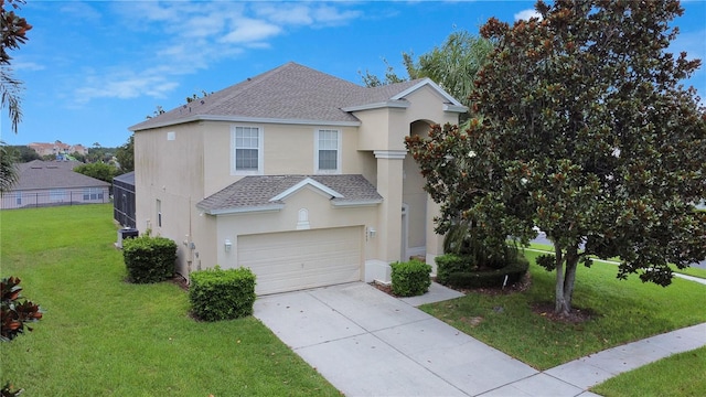 2669 Manesty Ln, Kissimmee, FL 34747 - traditional-style house featuring stucco siding, a shingled roof, concrete driveway, a front yard, and a garage