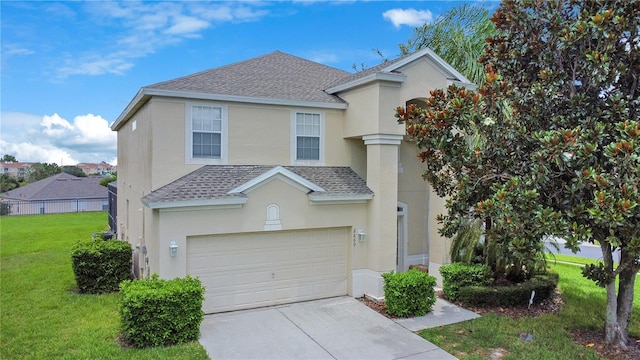 2669 Manesty Ln, Kissimmee, FL 34747 - view of front facade featuring roof with shingles, stucco siding, concrete driveway, and an attached garage