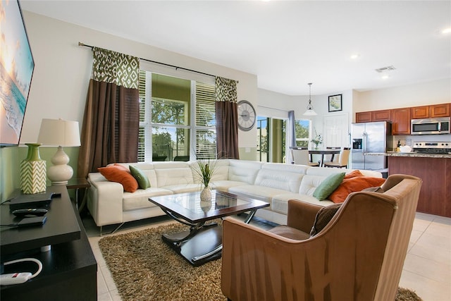 2669 Manesty Ln, Kissimmee, FL 34747 - living area featuring light tile patterned floors and recessed lighting
