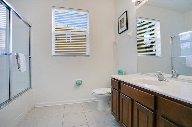 2669 Manesty Ln, Kissimmee, FL 34747 - full bath with vanity, tile patterned floors, and shower / bath combination with glass door