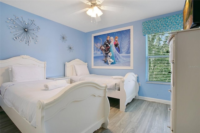 2669 Manesty Ln, Kissimmee, FL 34747 - bedroom featuring light wood finished floors and ceiling fan