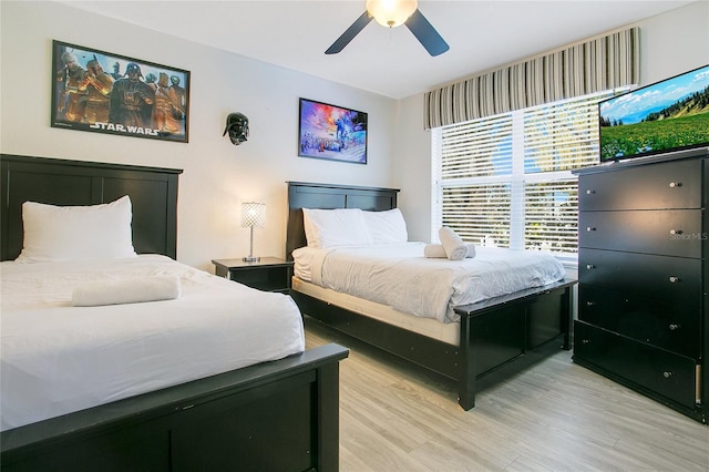 2669 Manesty Ln, Kissimmee, FL 34747 - bedroom featuring light wood-type flooring and ceiling fan