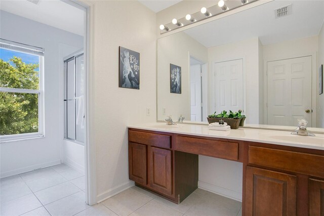 2669 Manesty Ln, Kissimmee, FL 34747 - full bath featuring double vanity and tile patterned flooring
